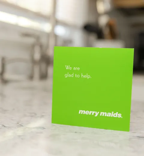 green merry maids card on a kitchen countertop